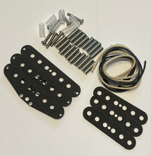 Load image into Gallery viewer, A set of guitar hardware and pickguard components laid out on a white background, including four black pickguards, silver screws, metal studs, clear plastic plugs, and a coil of black and beige wire.